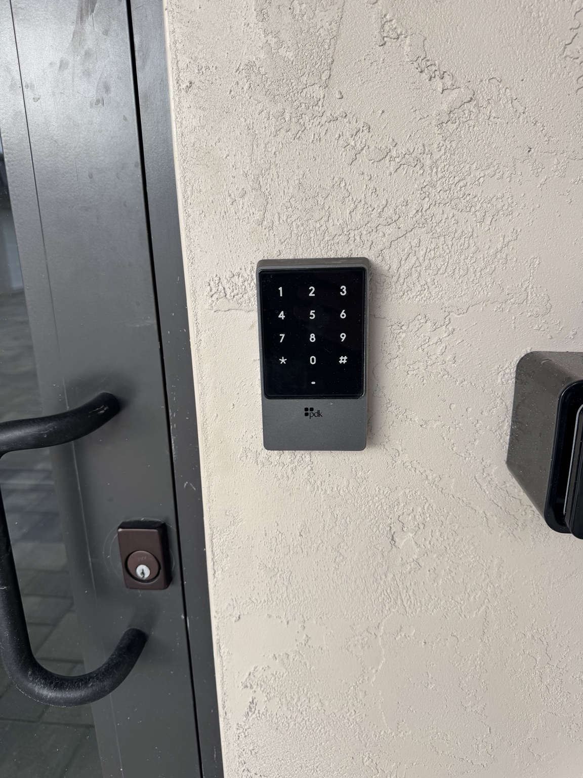 PDK access control keypad installed at an entry door